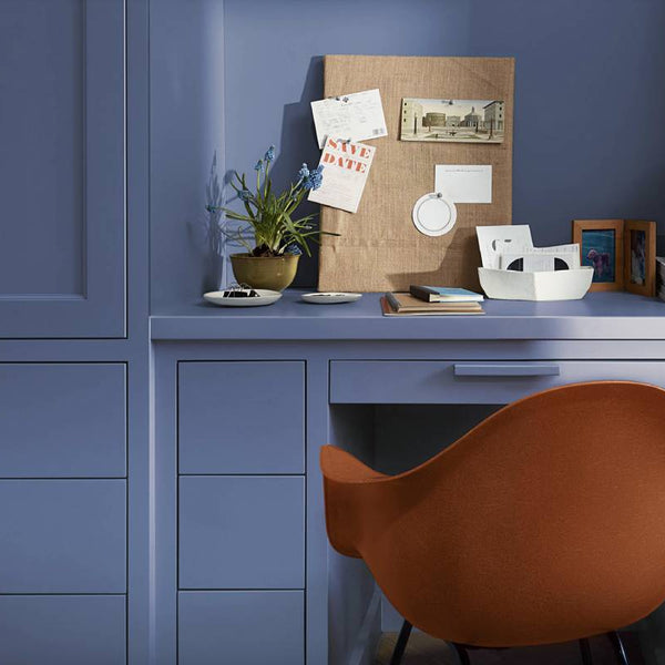 Room with walls and a desk painted in Benjamin Moore Blue Nova